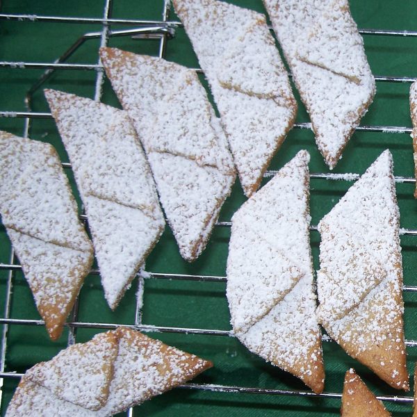 Homemade Vanillekipferl (vanilla crescents) on a cooling rack